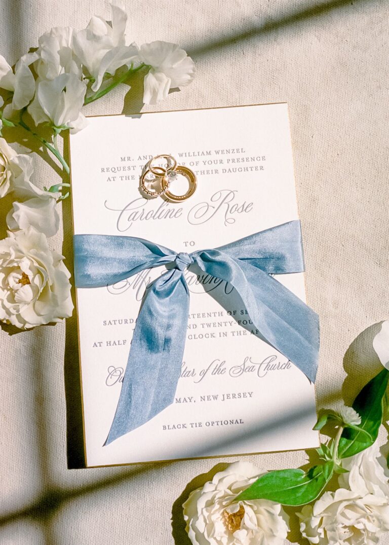 Elegant and formal coastal letterpress wedding invitation card with blue silk ribbon